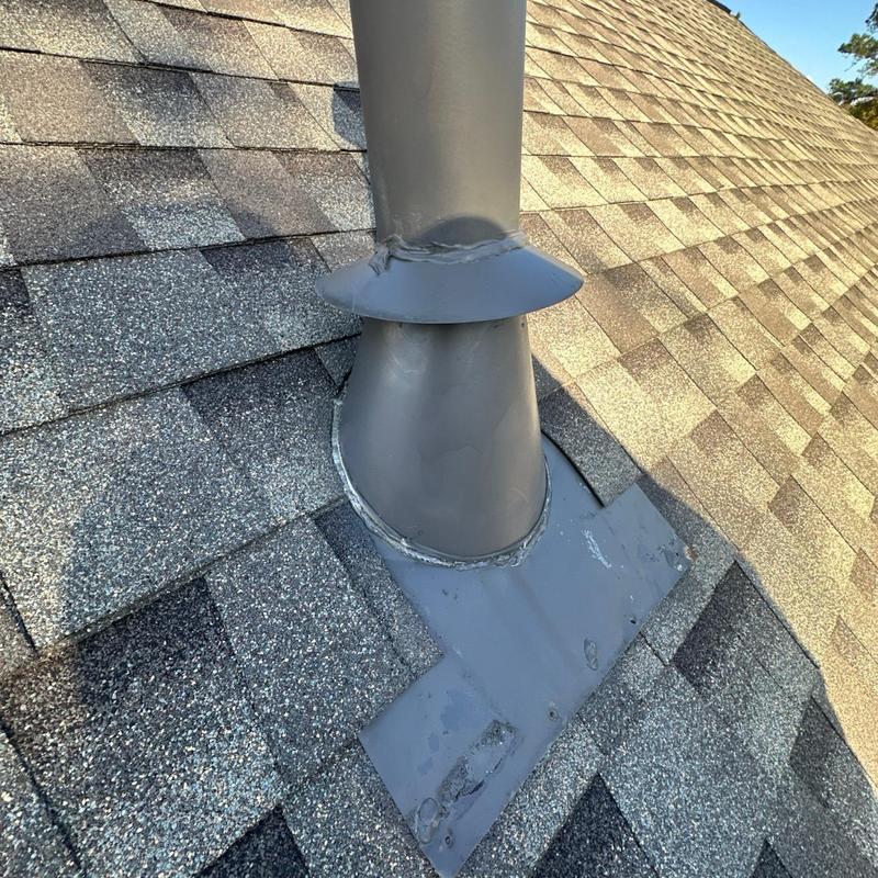 Furnace vent flashing with resealed roof sealant