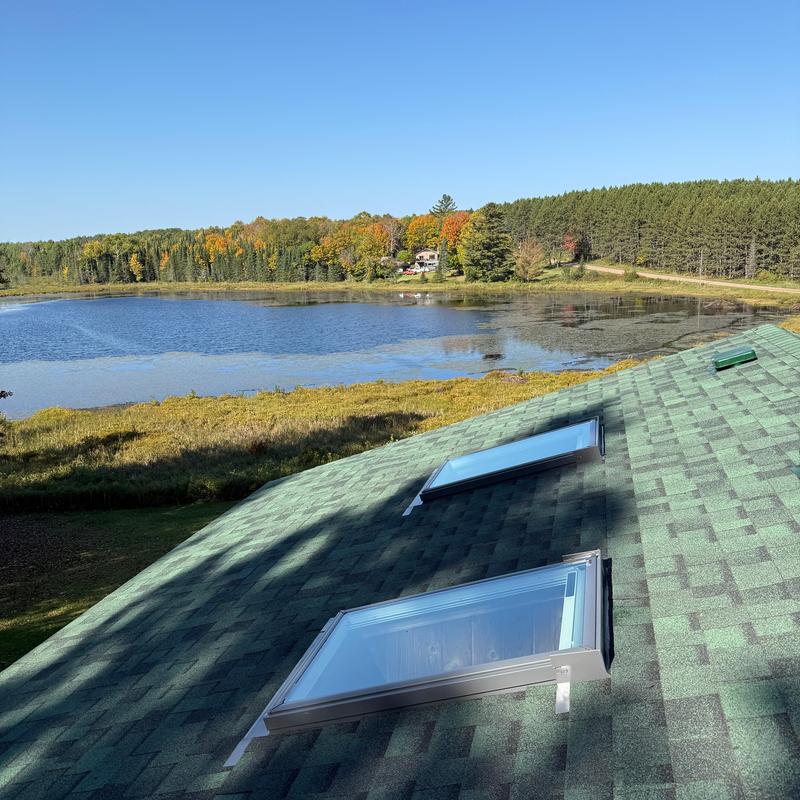 Velux skylights installation on green shingle roof