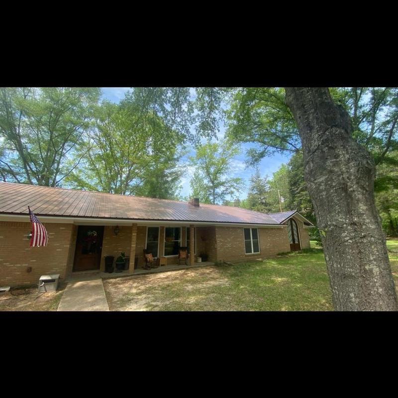 Metal roof system on brick residential house in Florence