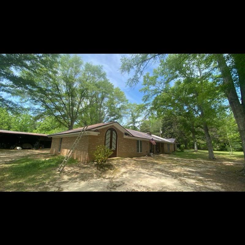Metal roof system on brick residential house