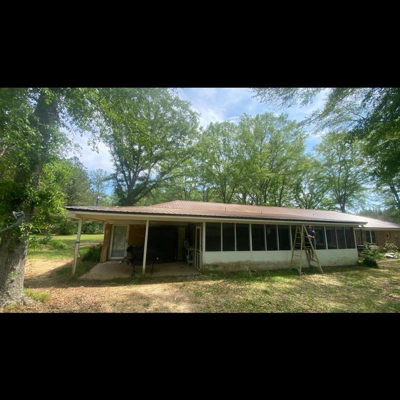 Metal roof panels installation on residential house