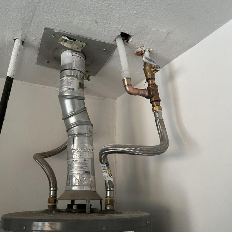 Water heater vent and copper water lines with valve