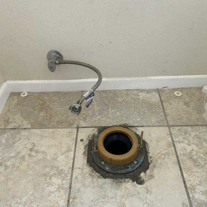 Cast-iron closet flange installed on tiled floor