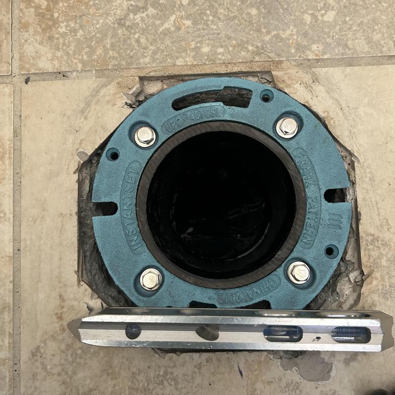 Cast-iron closet flange installed in bathroom floor
