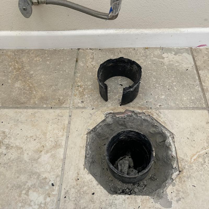 Drain pipe under toilet with broken pipe section removed