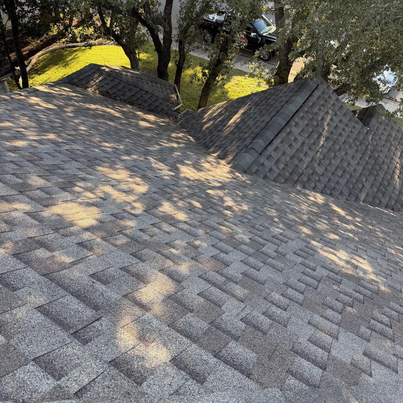 Owens Corning asphalt shingle roof with sunlight shadows