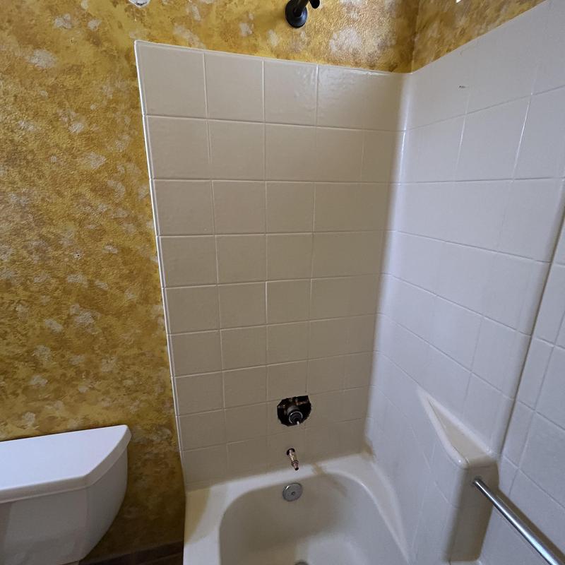 Shower valve installation with cut fiberglass access panel