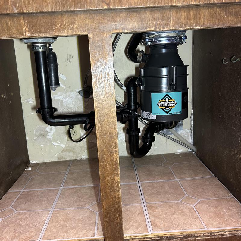 Garbage disposal with new drain lines under sink