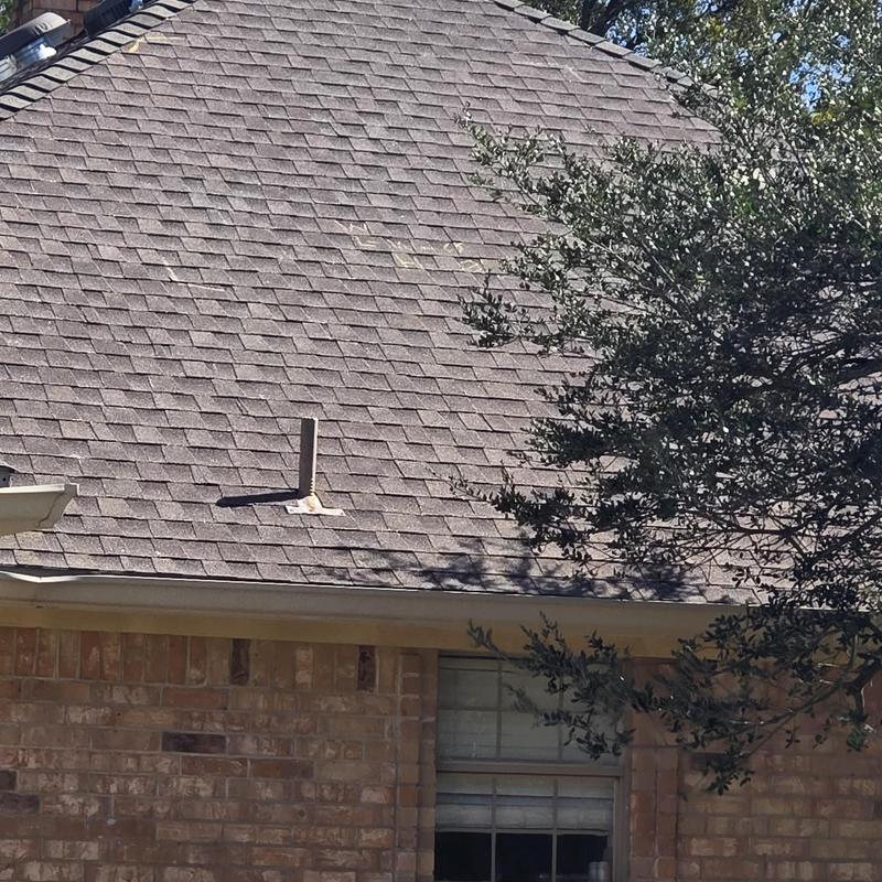 Asphalt shingle roof with hail damage inspection