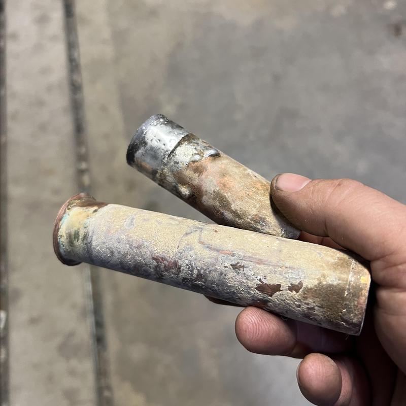 Irrigation line copper pipe section with corrosion damage Irrigation line copper pipe section with corrosion damage