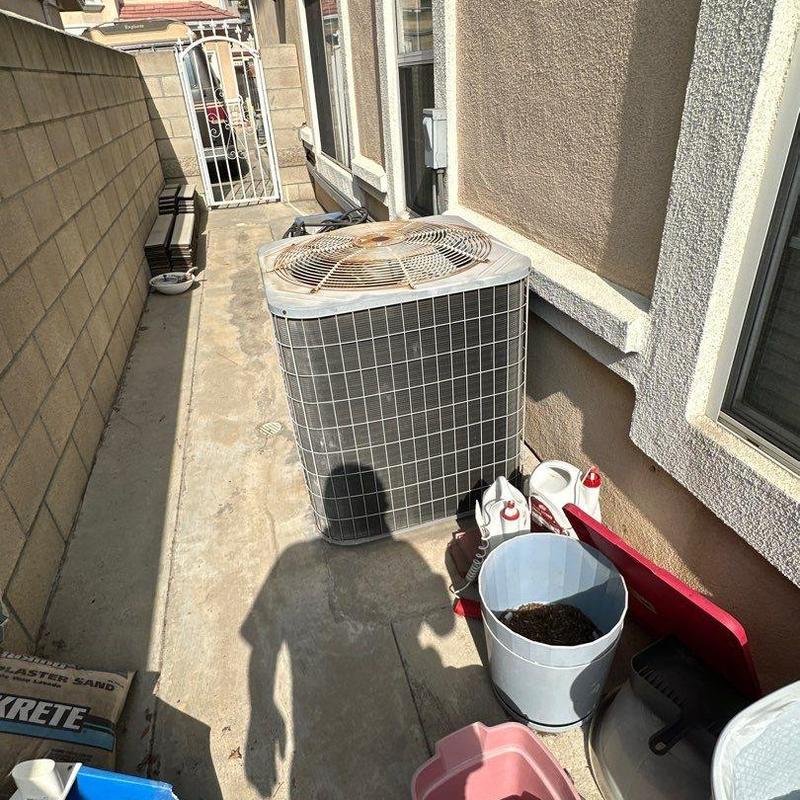 Condenser unit with rust on fan and outdoor coils