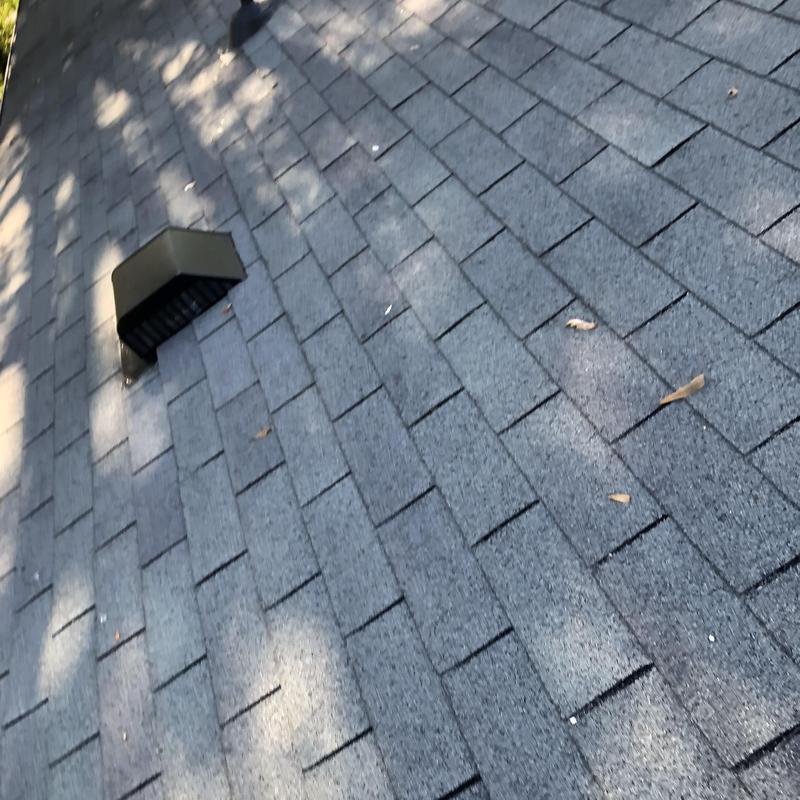 Roof shingles and vent with new pipe boot and flashing