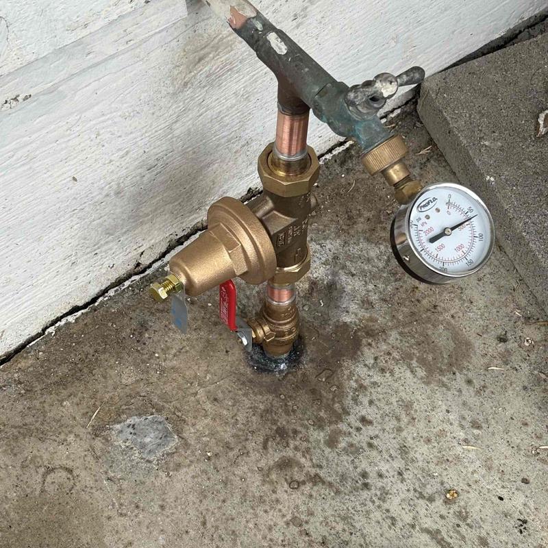 Water main pressure gauge and valve assembly installation