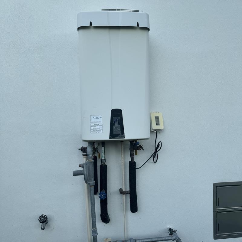 Navien tankless water heater with piping and valve