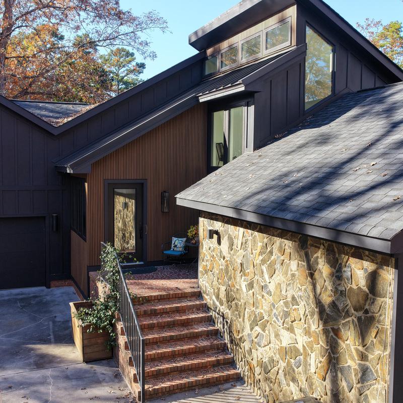 Roof shingles and stone siding with brick steps exterior