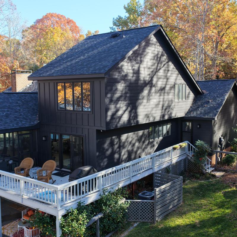 New roof and dark siding on two-story house