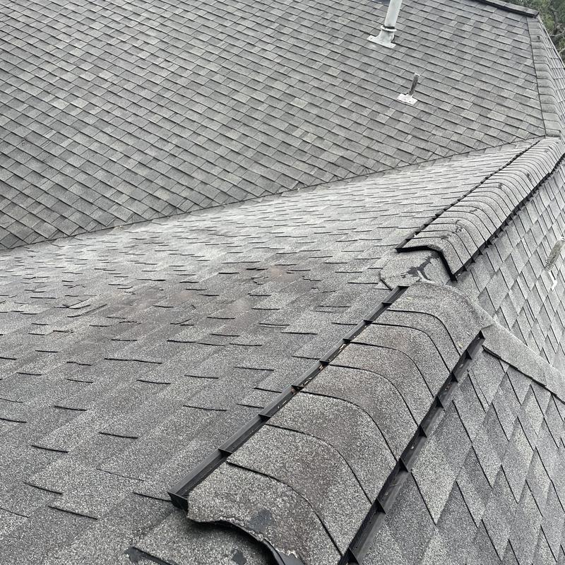 Architectural laminate shingles with hail and wind damage