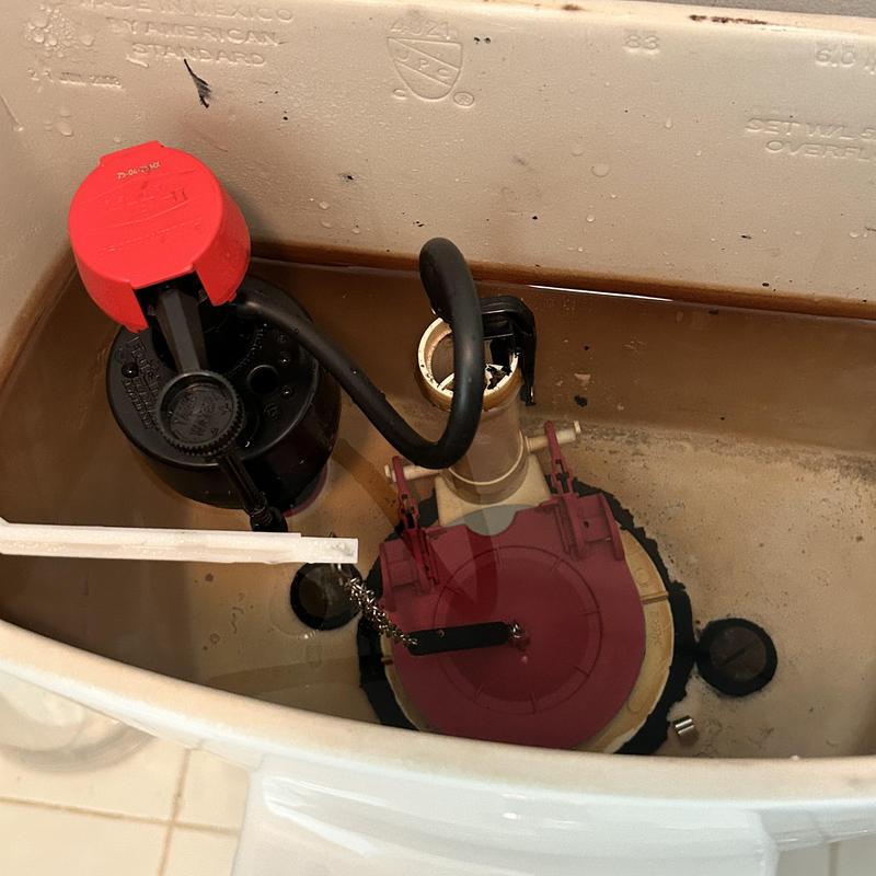 Toilet flapper and fill valve inside tank replacement