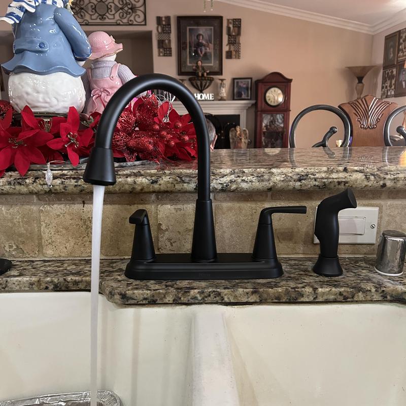 Kitchen faucet with water flow and soap sprayer installed
