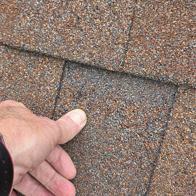 Asphalt shingle granule loss from hail damage