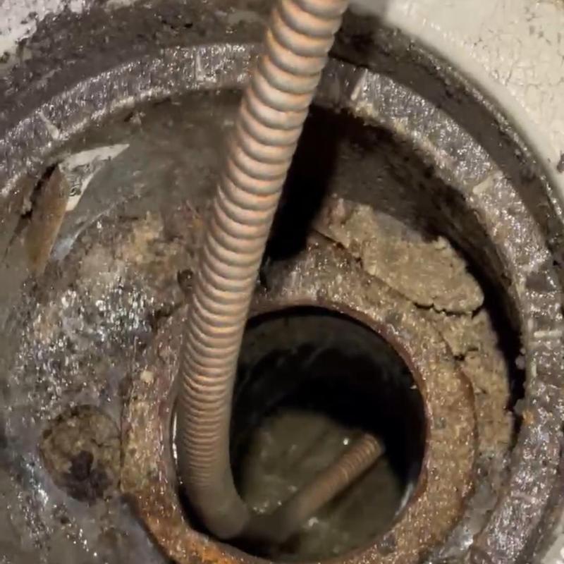 Sewer cleanout with snake clearing clog in Stockton