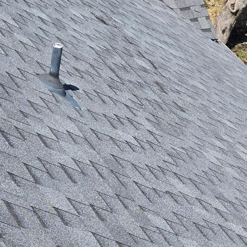 Asphalt roof shingles with wind and hail damage