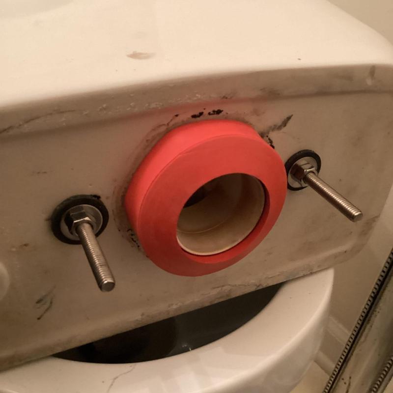 Toilet tank mounting bolts and gasket installation detail