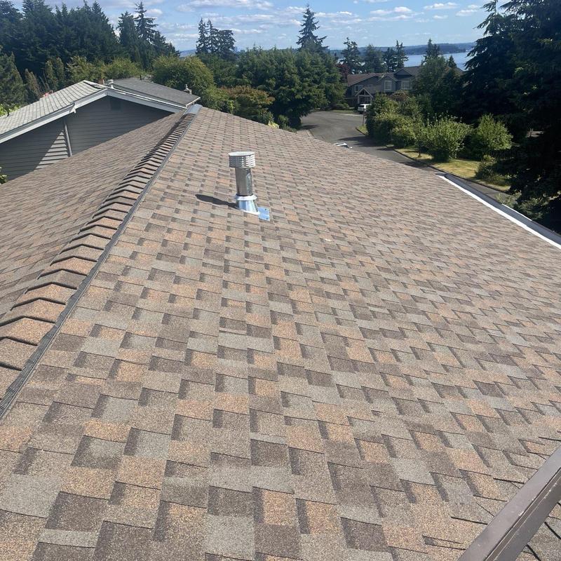 Asphalt shingle roof with vent pipe in Kirkland, WA