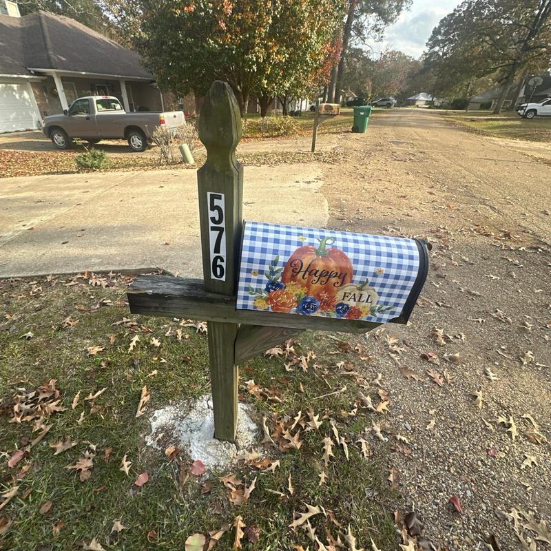 Mailbox with fall-themed cover and house numbers