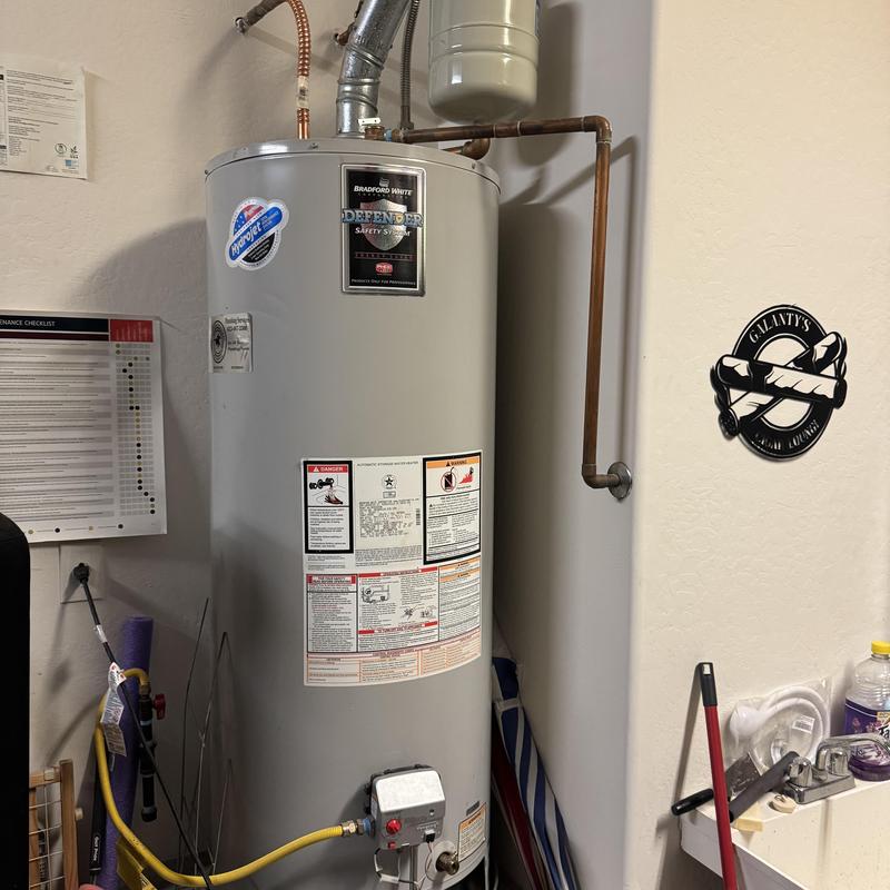 Bradford White gas water heater with piping