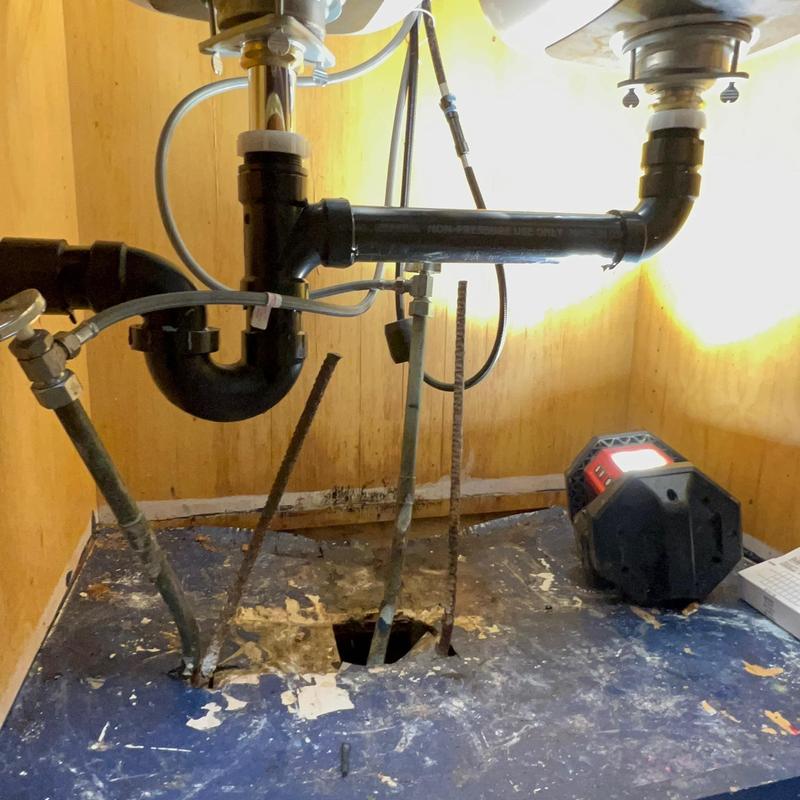 Kitchen sink drain piping under countertop with new ABS pipes