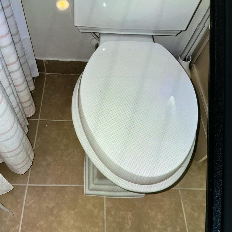 Kohler toilet installed on tiled bathroom floor