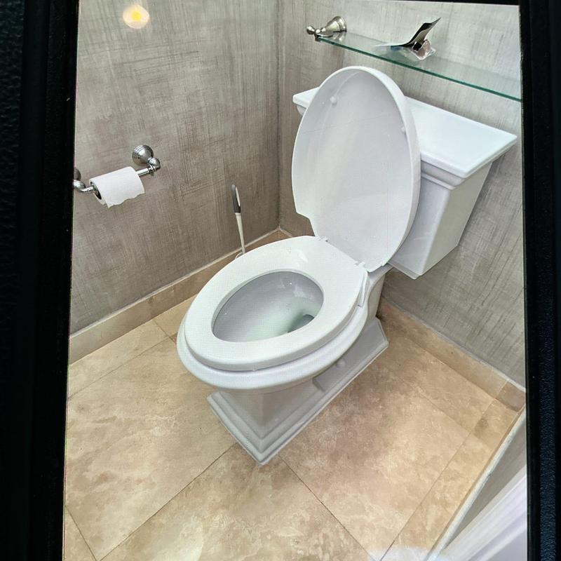 Kohler toilet installation in bathroom corner