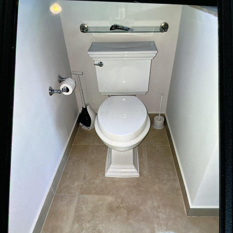 Kohler toilet installation in small bathroom corner