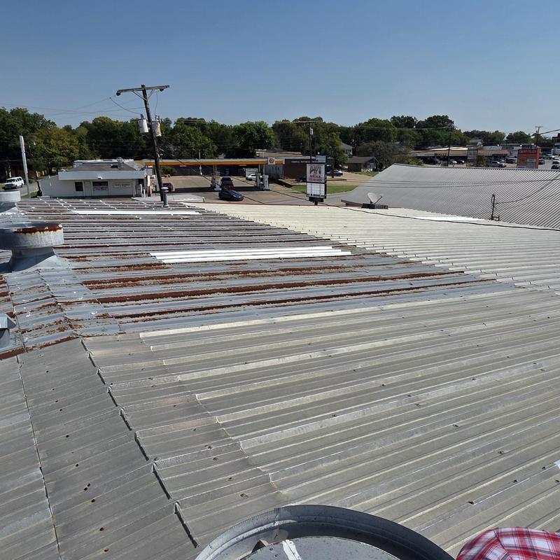 Metal roof panels with rust and hail damage inspection