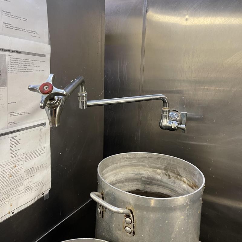 Commercial pot filler faucet installed over stock pot