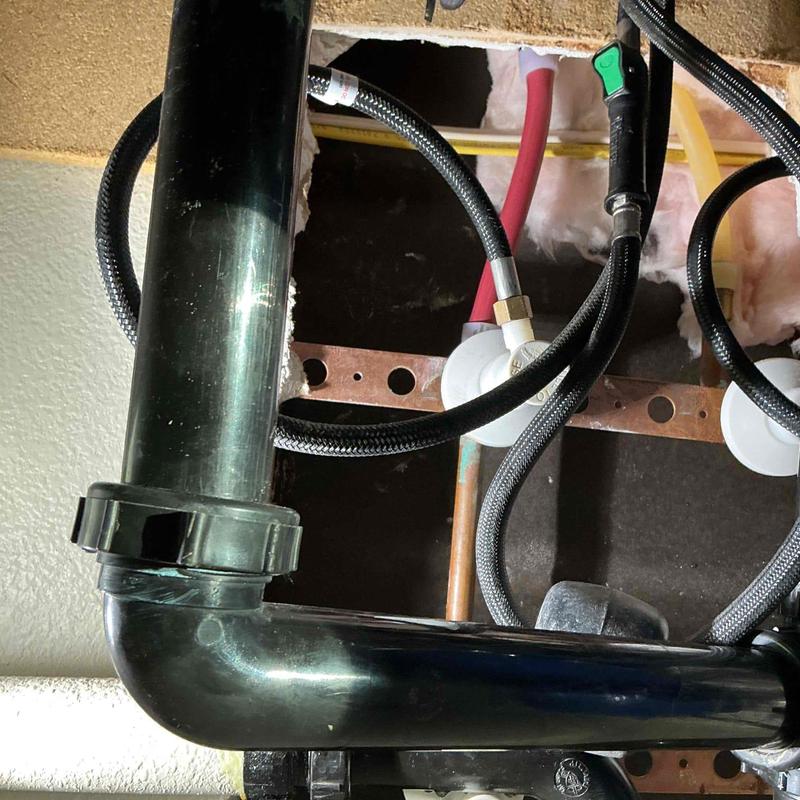 Pex hot water line and dishwasher drain plumbing under sink