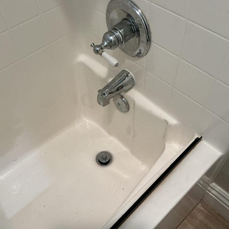 Tub spout diverter and shower valve in guest restroom tub