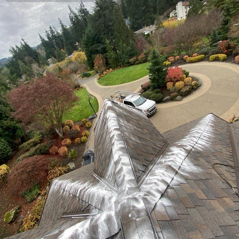 Roof ridge with moss treatment residue in Bellevue, WA