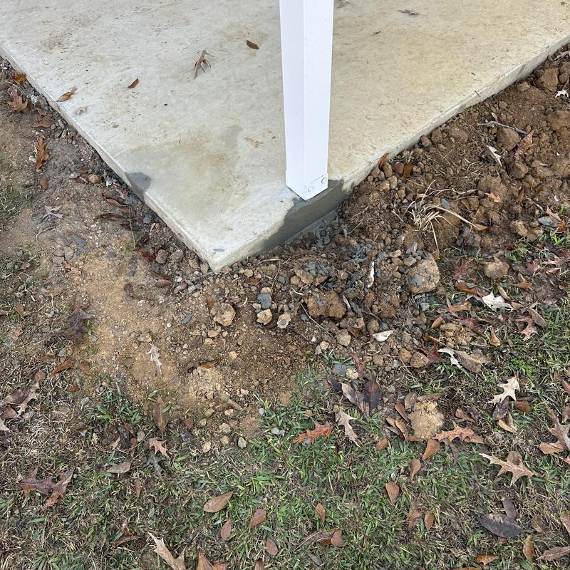 Concrete slab corner with patched chipped area near post Concrete slab corner with patched chipped area near post