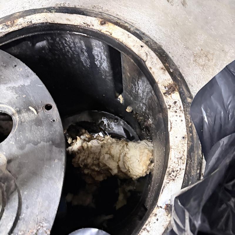 Ejector pit clogged with debris inside basin