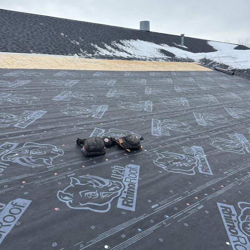Roof underlayment installation on building addition roof Roof underlayment installation on building addition roof