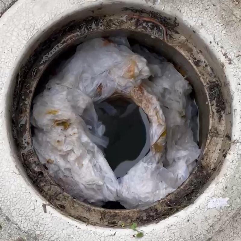 Main drain clogged with plastic debris blockage
