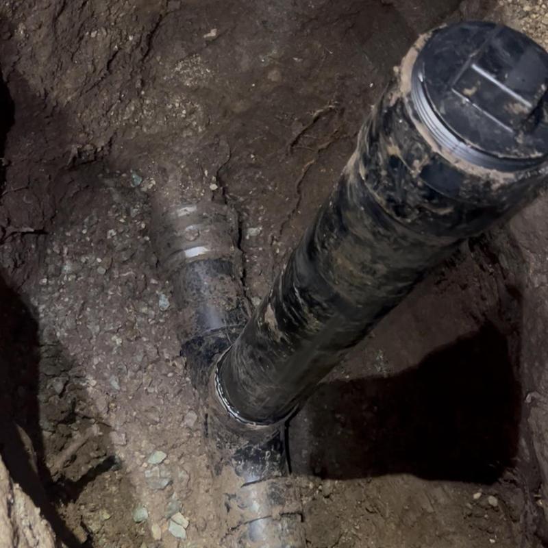 4-inch ABS sewer cleanout installation in soil trench