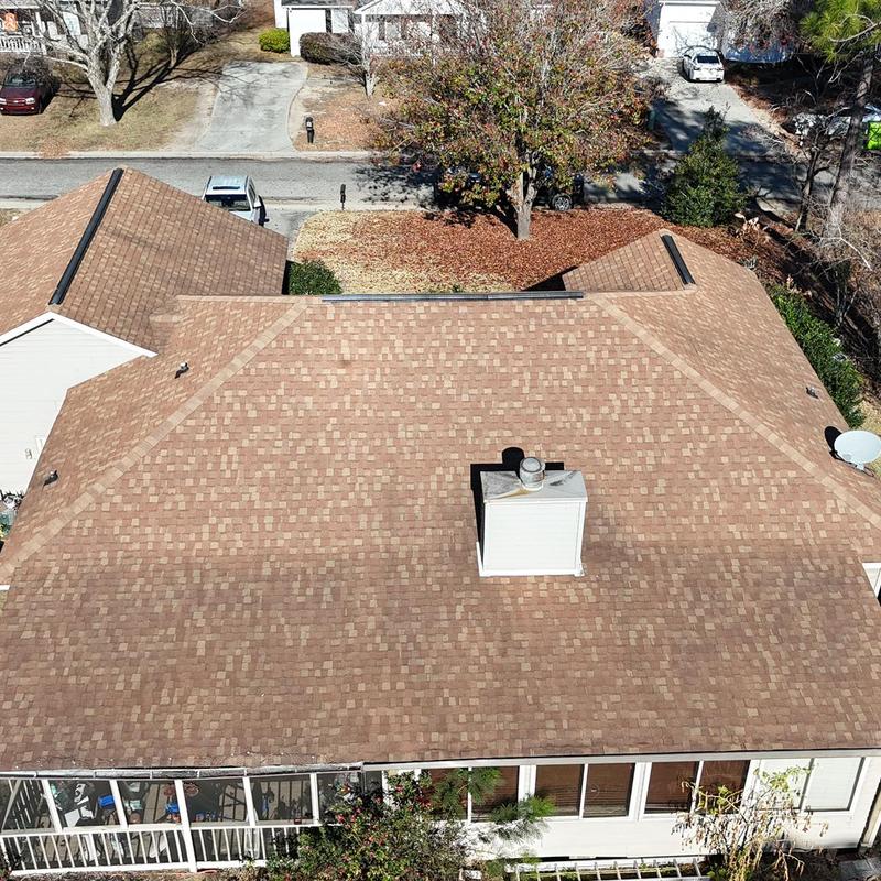 Asphalt shingle roof on residential house aerial view