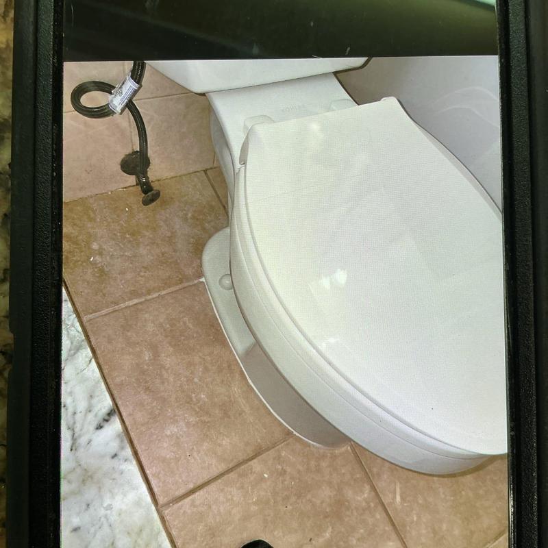 Kohler toilet installed on tiled bathroom floor