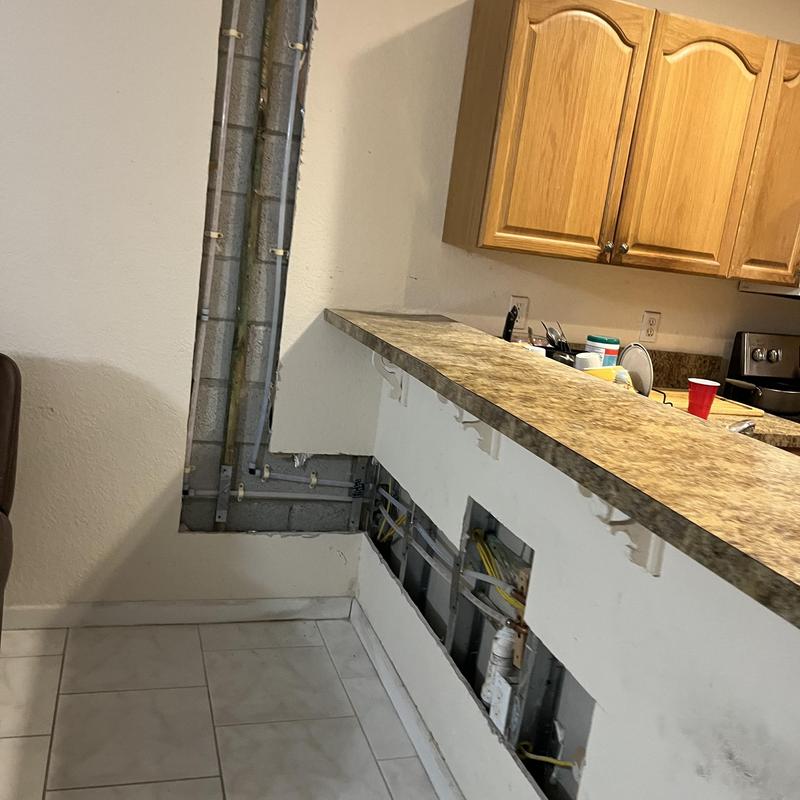 Copper waterlines behind kitchen drywall cut and exposed