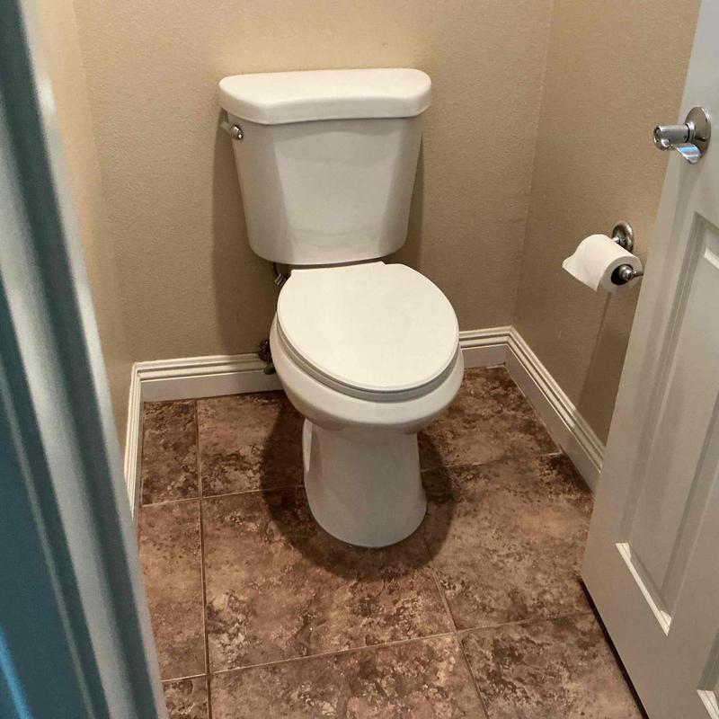 Toilet installation with new wax ring and supply line