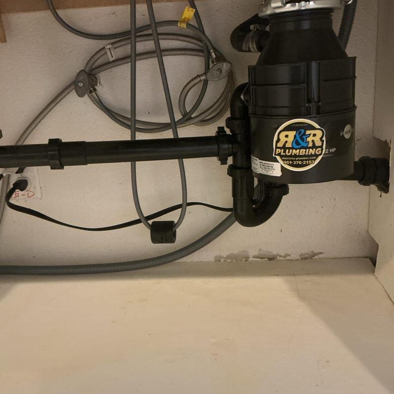 Garbage disposal and drain piping installation under sink