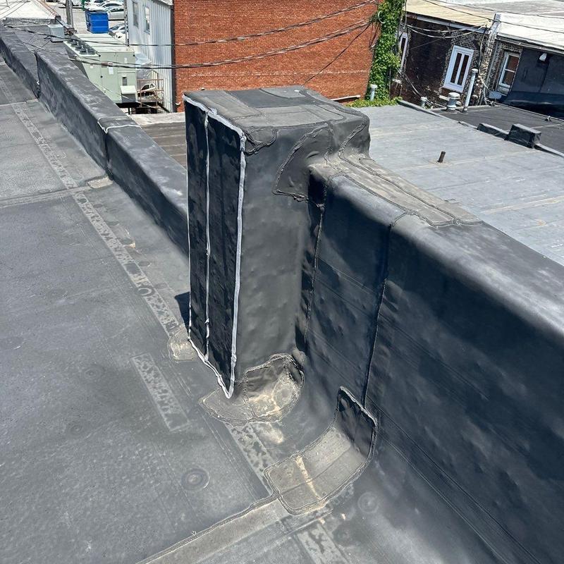 Commercial flat roof membrane and wall flashing detail